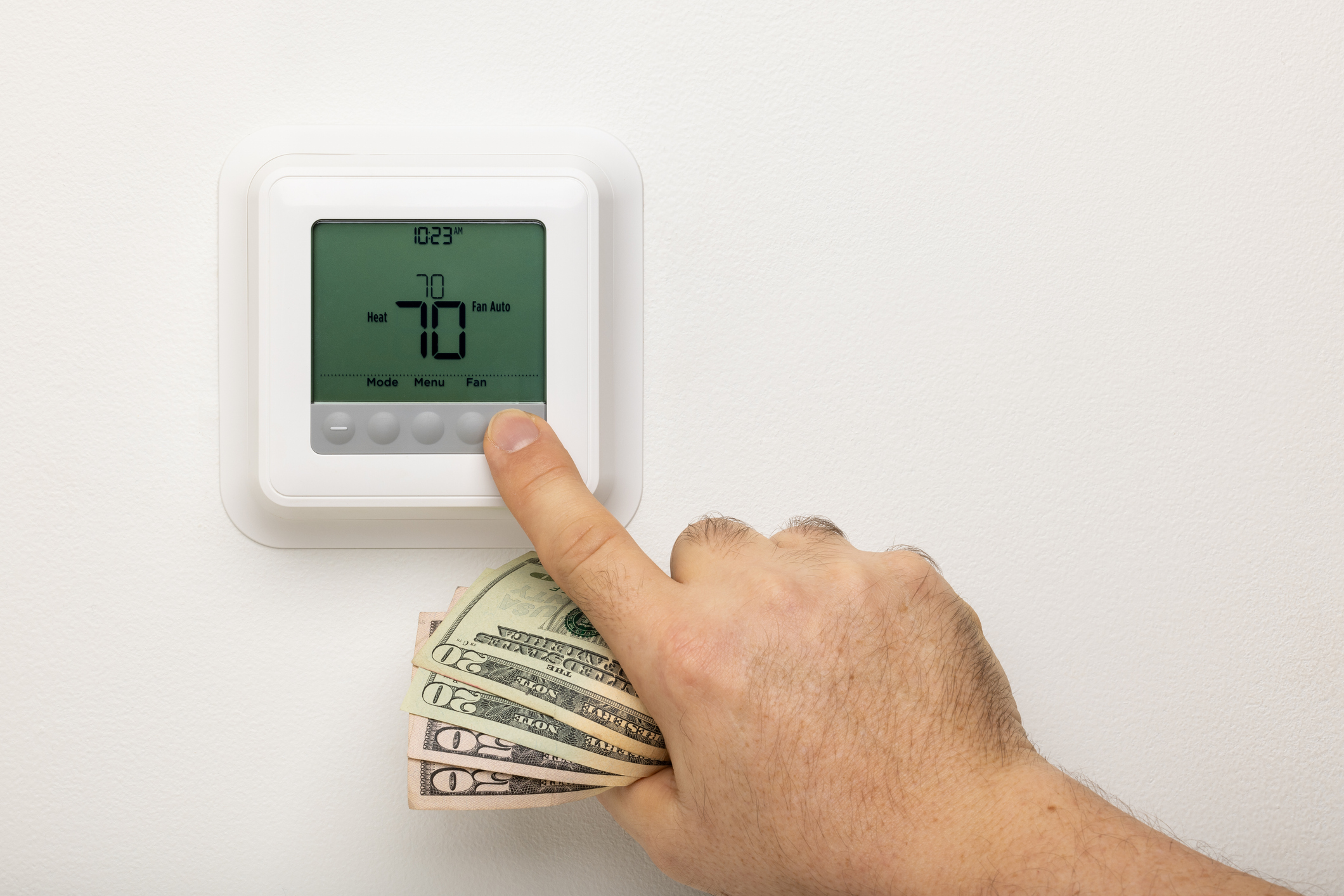 Adjusting a thermostat holding cash